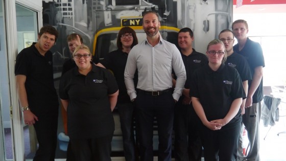 Pictured is John Heron (centre) and some of the team at The Vault