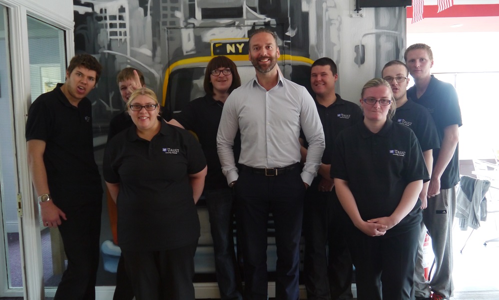Pictured is John Heron (centre) and some of the team at The Vault