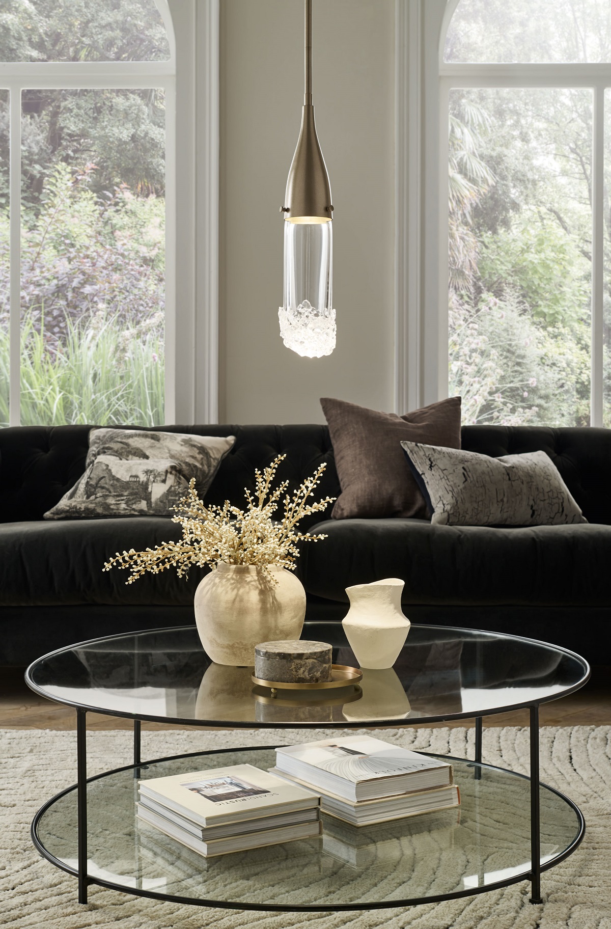Single Fizz pendant light above a glass coffee table