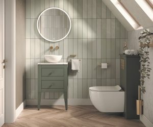 green wooden bathroom vanity unit with basin on top and a round mirror above