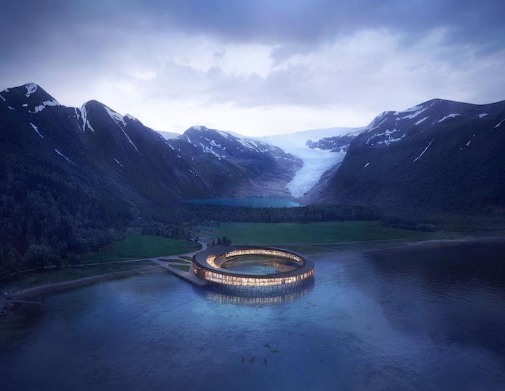 render of hotel in the middle of water next to snow-capped mountains