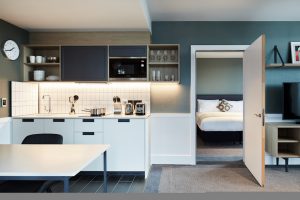 grey and white kitchenette with view to guestroom in Hyatt house Manchester