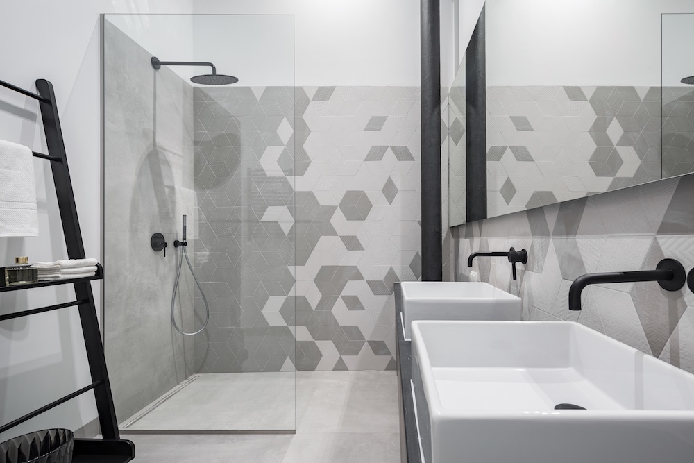 New design bathroom with shower and two basins, in gray and white with black details