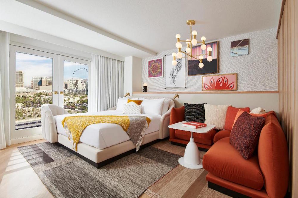A render of a hotel room inside the Virgin Hotels property with views of The Strip of Las Vegas