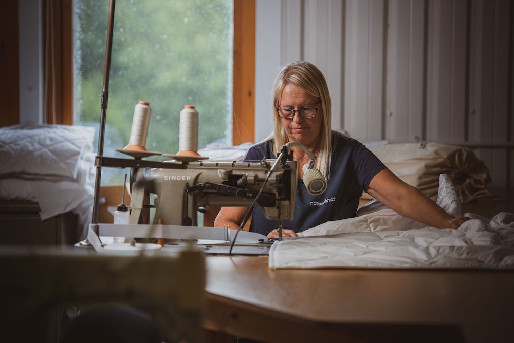 A women sewing a mattress
