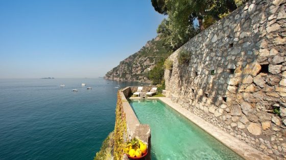 a long pool overlooking the Amalfi Coast