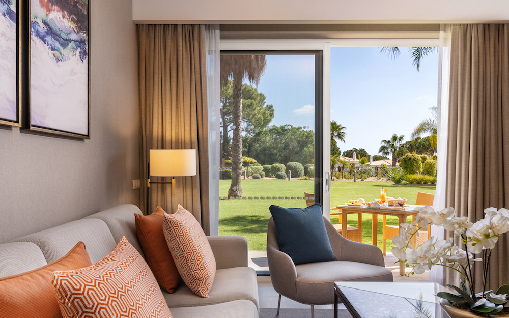 Image of lounge of hotel that is opening in March overlooking garden in Algarve