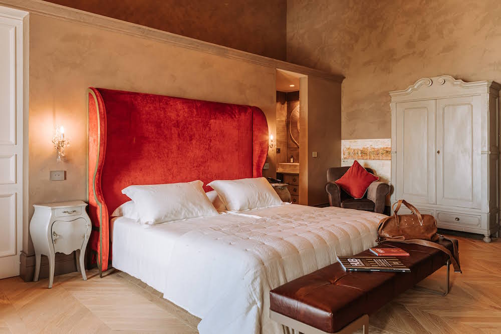 A large red headboard in a vintage setting