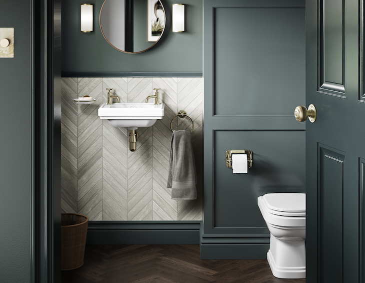 image of mid-tone green bathroom with white and gold basin