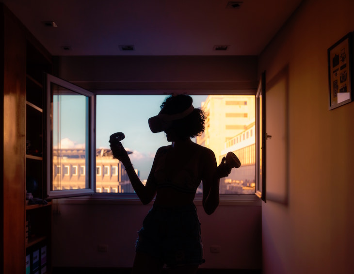 image of woman in hotel with virtual reality headset