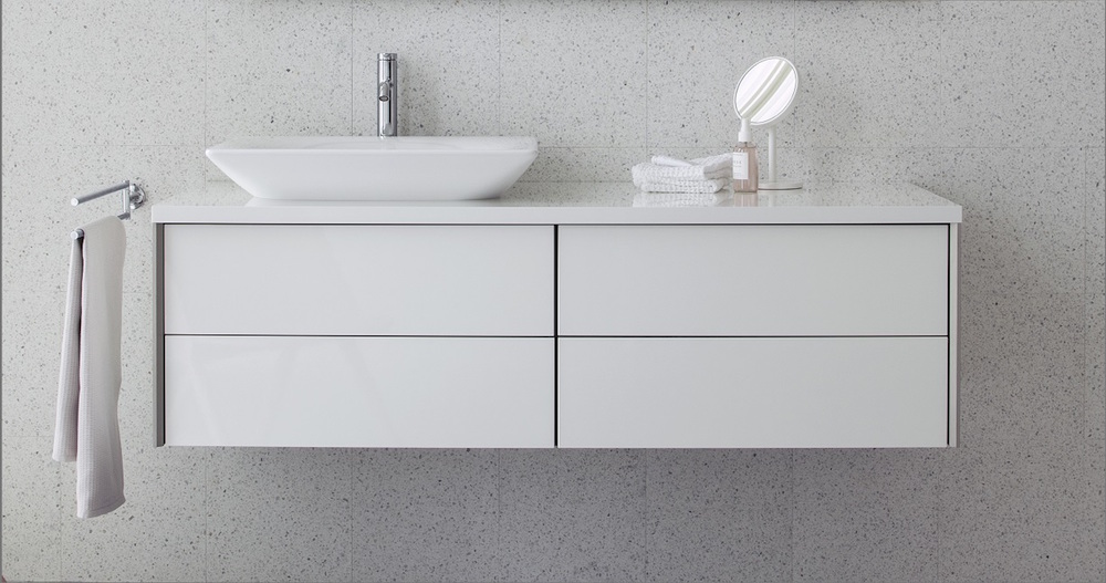 Image caption: XViu asymmetric washing area option with Viu above- counter basin positioned on the left and a generous vanity unit finished in high-gloss white varnish. | Image credit: Duravit