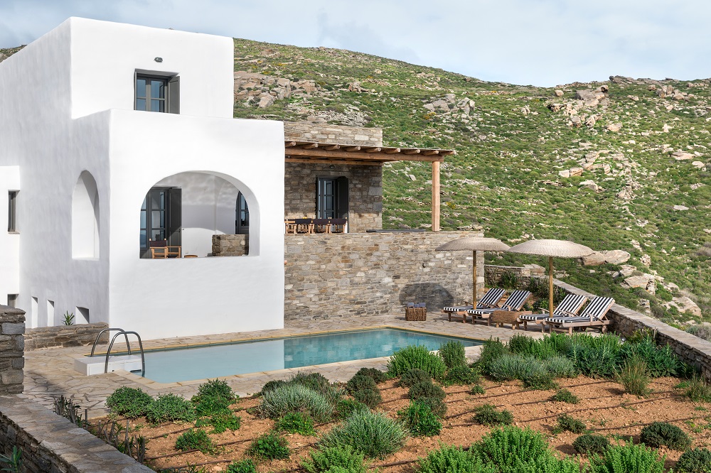 the white and stone walls of Acron Villas-Cycladic Architecture
