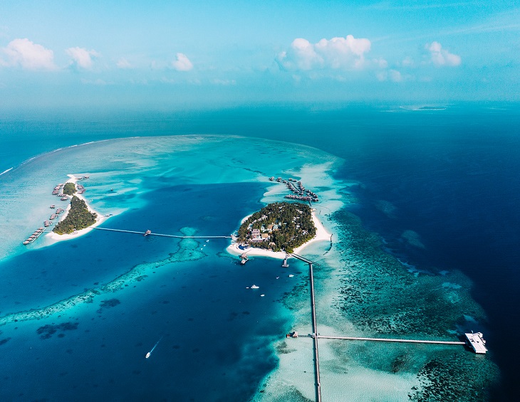 aerial view of twin island resort in the maldives