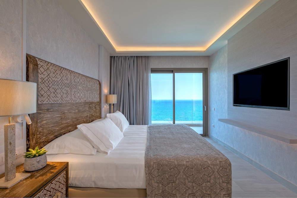 Guestroom with handmade headboard inside Amada Colossos Resort - Sea View Executive Suite_2