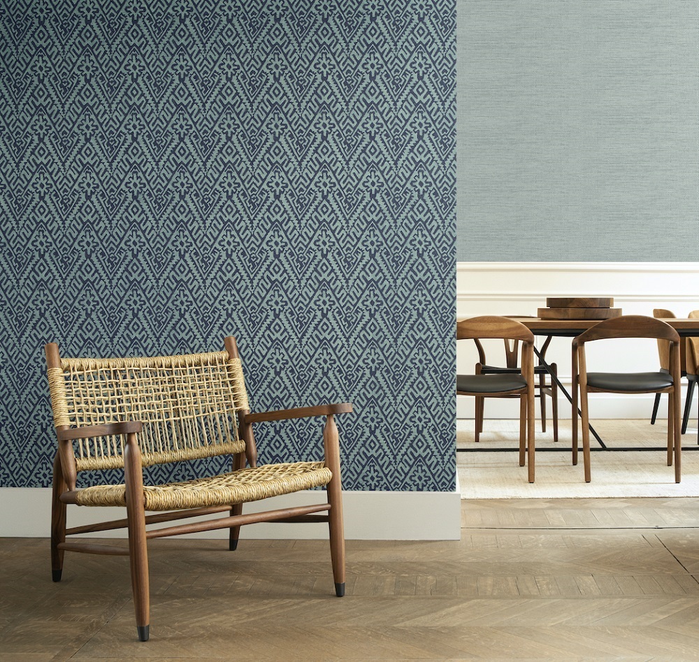 Rattan furniture and wooden floor with blue wallpaper by Arte