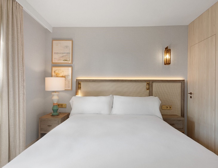 white bed linen and natural decor in guestroom at hilton mallorca galatzo