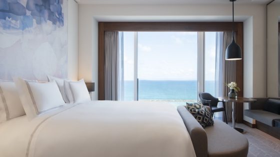 blue and white bedroom with seaview in tel aviv hotel David Kempinski
