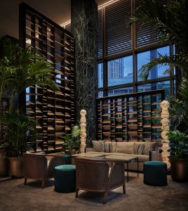 hotel lobby in blue and brown with art pieces in new orleans four seasons