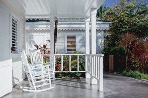 Caribbean veranda in white wood with rocking chair in rosewood st barth