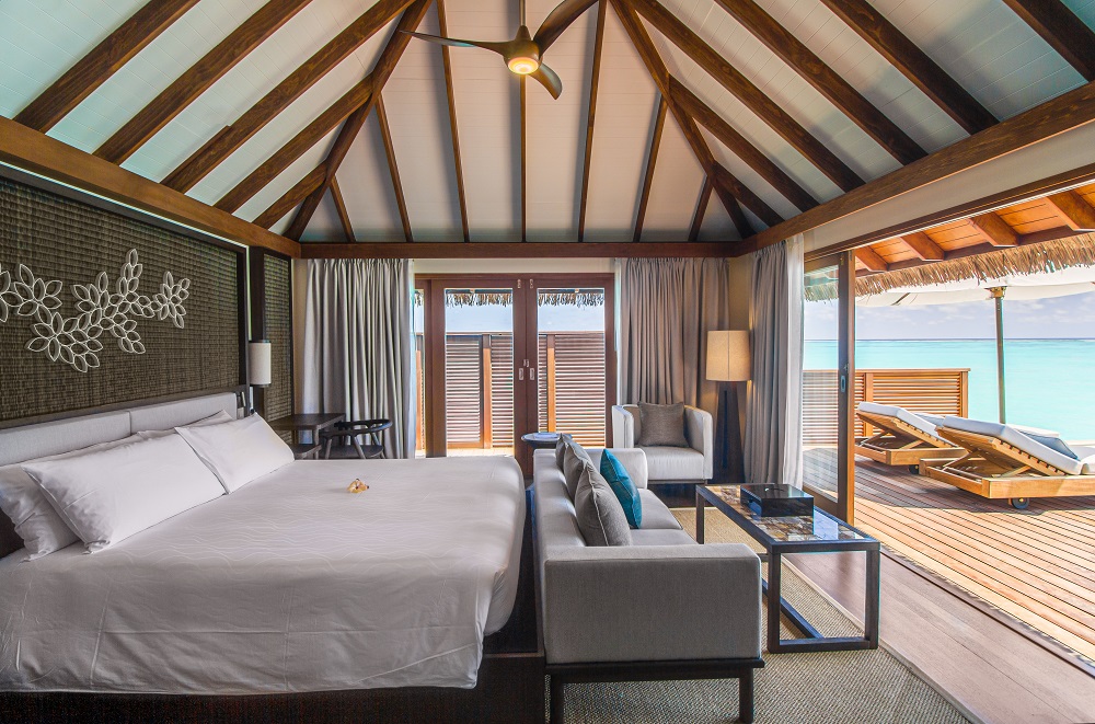 bed overlooking the ocean on the maldive island resort rangali water villa