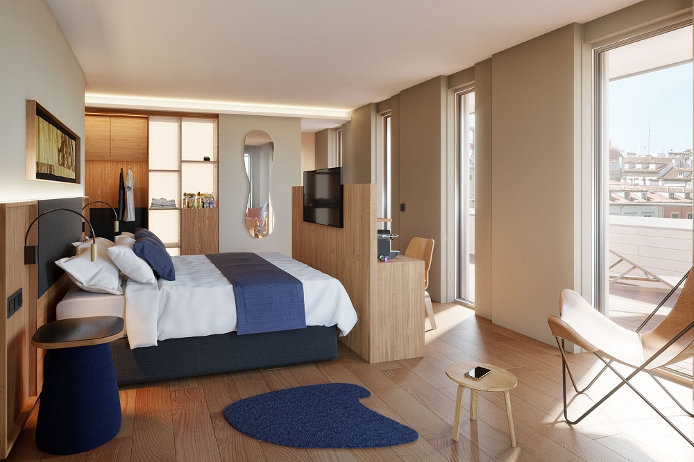 contemporary bedroom with city views over madrid, eames chair and blue accents