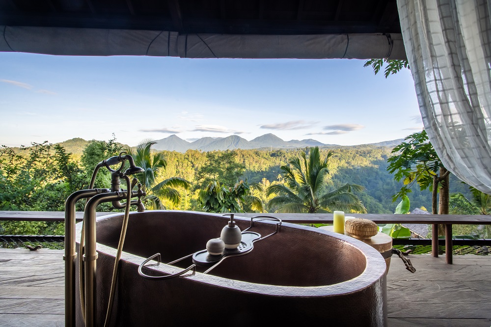 open air freestanding bath on guestroom deck at banyan tree escape