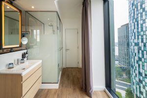 bathroom by Roca with panoramic cityscape views of Liverpool