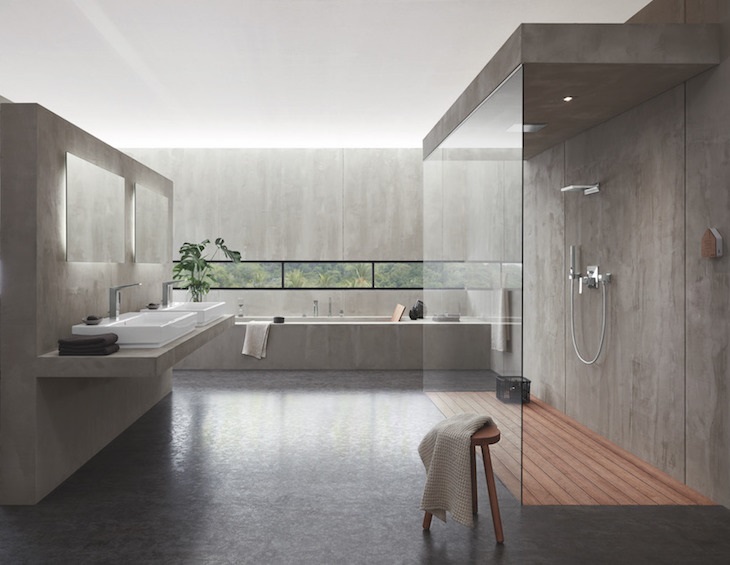 contemporary bathroom in glass and concrete with fittings by grohe