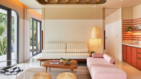 pink couch and natural finishes in bright suite at The Standard