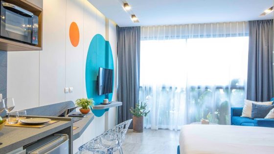 white and blue guestroom decor at HOMA hotel Phuket