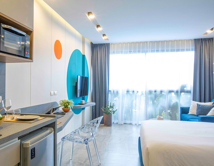 white and blue guestroom decor at HOMA hotel Phuket