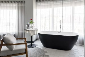 Black freestanding bath in Accor Hotel guestroom
