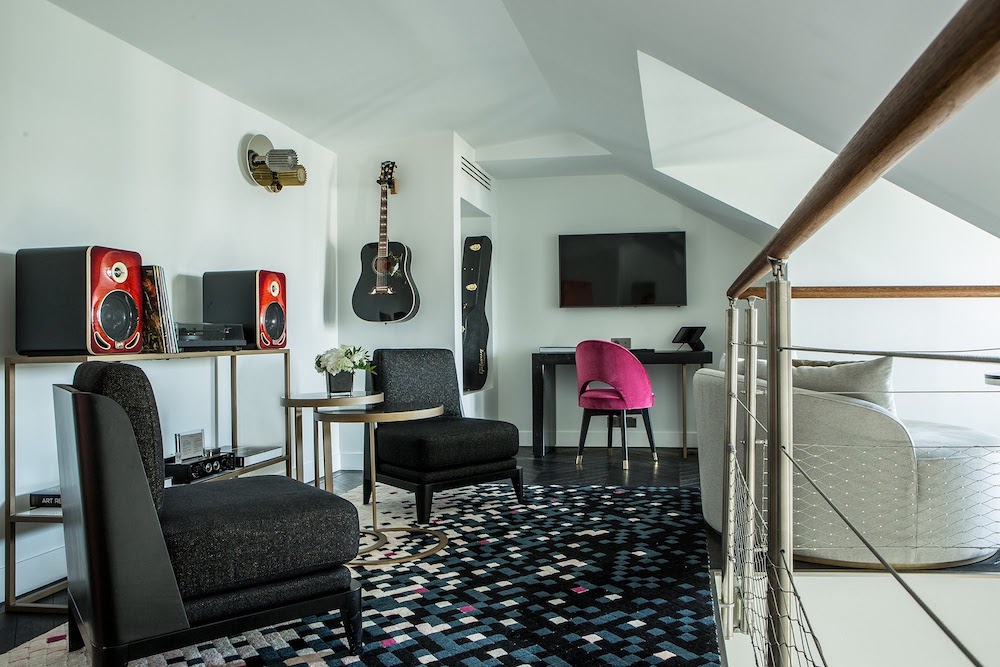 Split-level suite, featuring guitar on the wall and record player