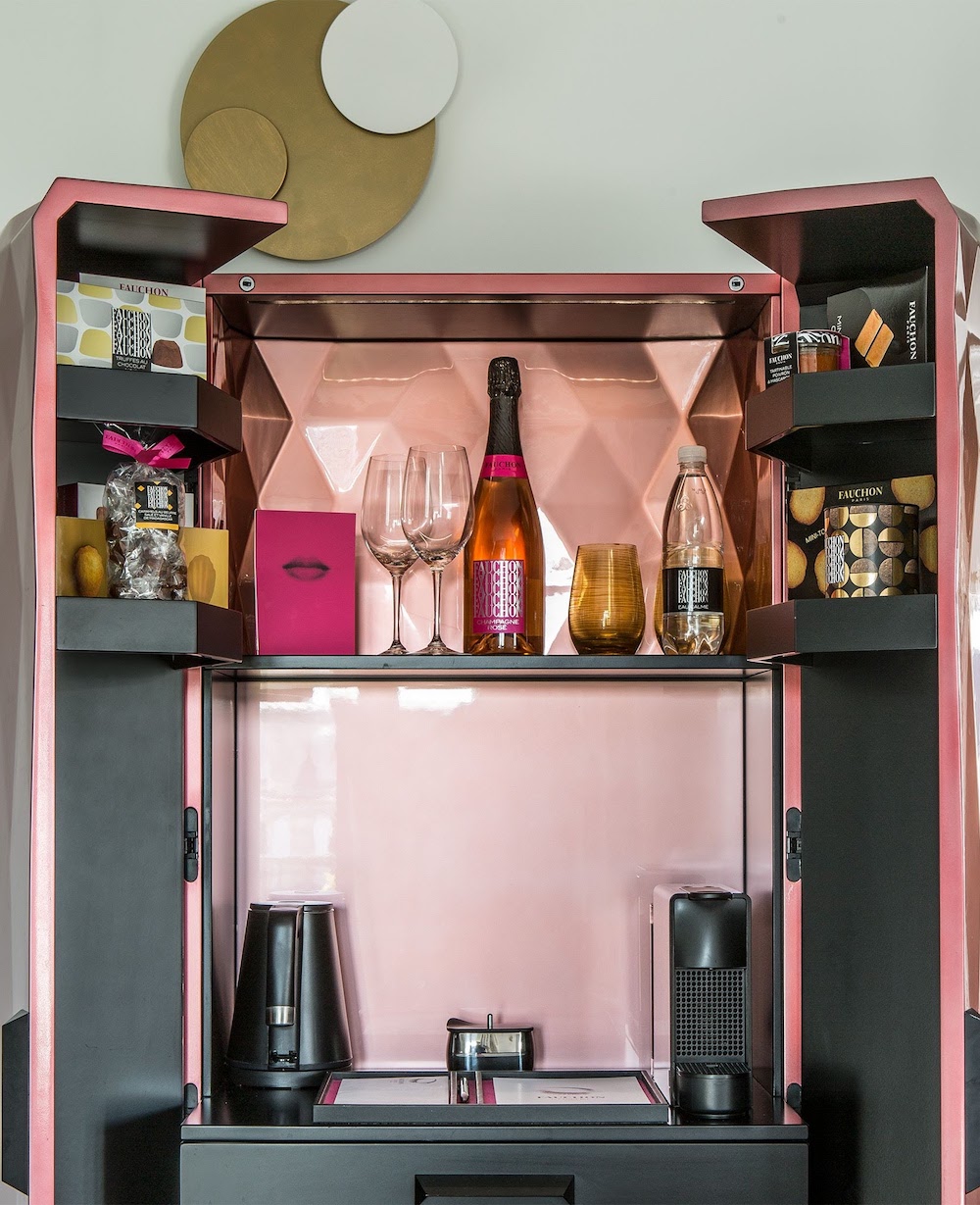 A brushed gold minibar inside the Paris hotel