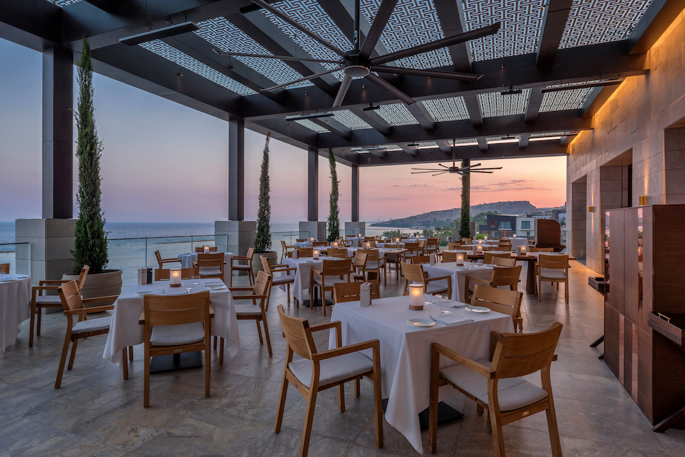Dining terrace next to sea at luxury hotel in Cyprus