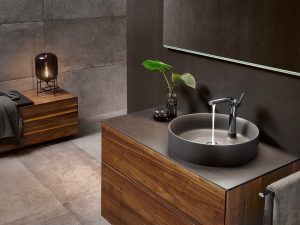 countertop washbasin in gray ceramic with natural wood finish from the edition lignatur range