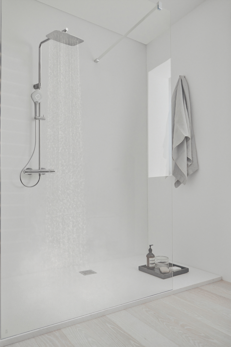 A white bathroom with chrome Ideal Standard shower