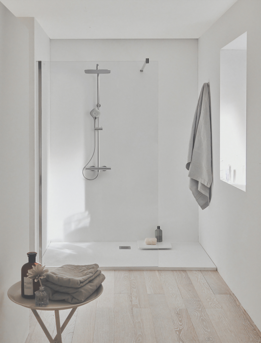 A white bathroom with chrome Ideal Standard shower