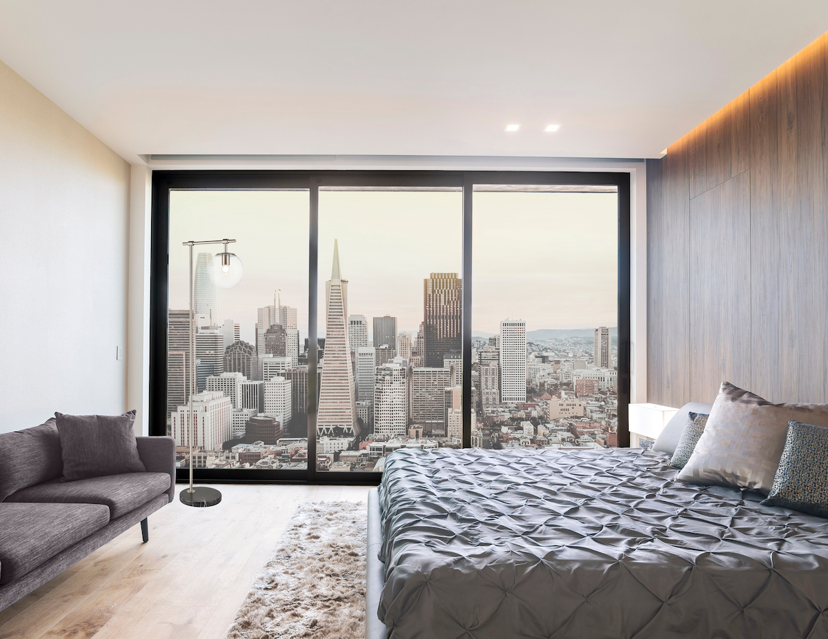 Modern and contemporary bedroom in San Francisco with views of the financial district of the city. Condo or Hotel accommodation.
