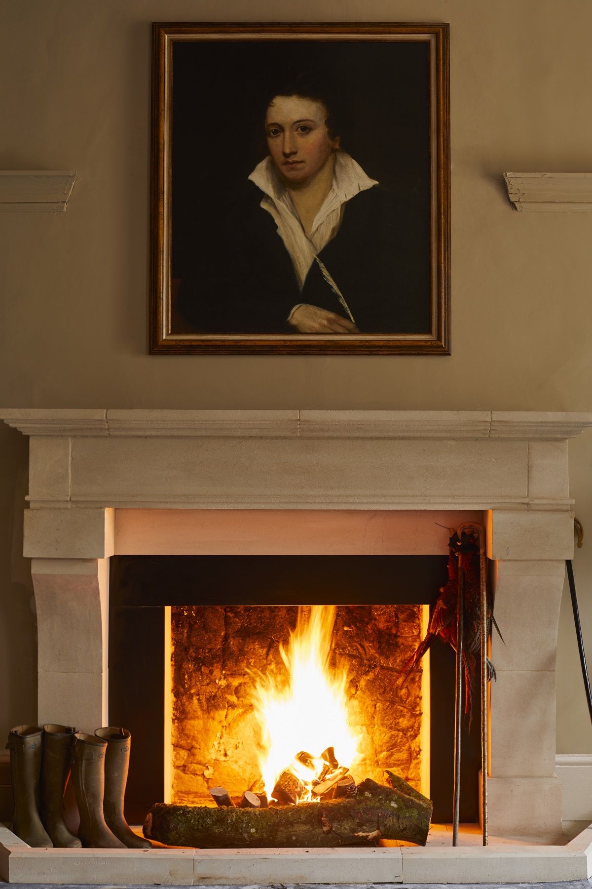 fireplace with portrait of percey shelley at the retreat elcot park