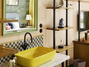 yellow basin and vintage furniture bathroom detail in 25hours hotel in copenhagen