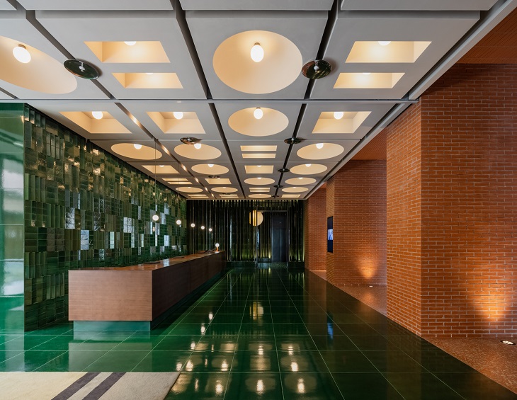 green ceramic tiles and brickwork in the reception at Hyatt Unbound Taoxichuan