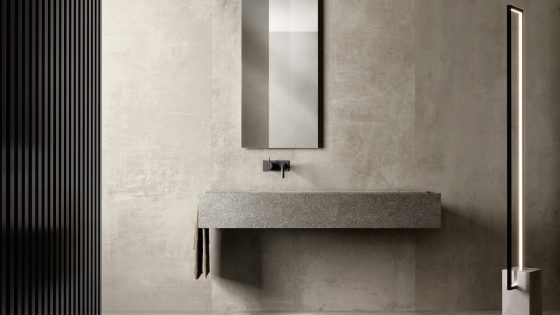 Industrial sink with contemporary lighting in concrete room