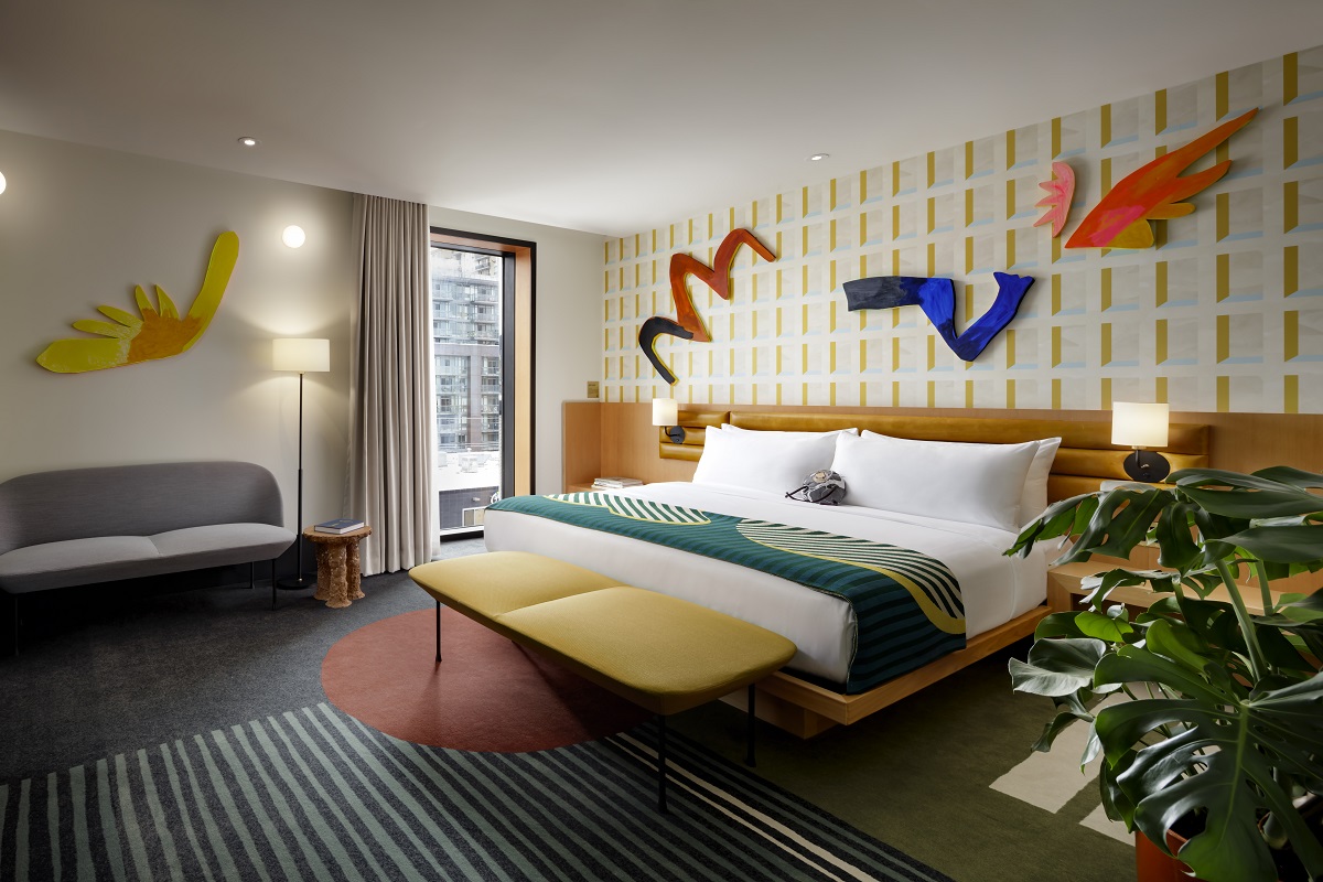 guestroom in the Modern wing with contemprary art work and vintage furniture