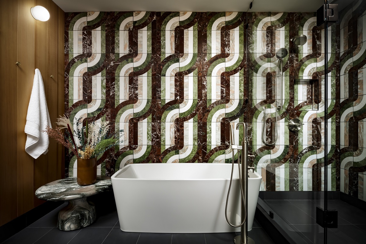 bathroom at The Drake with retro pattern wall tiles and freestanding bath