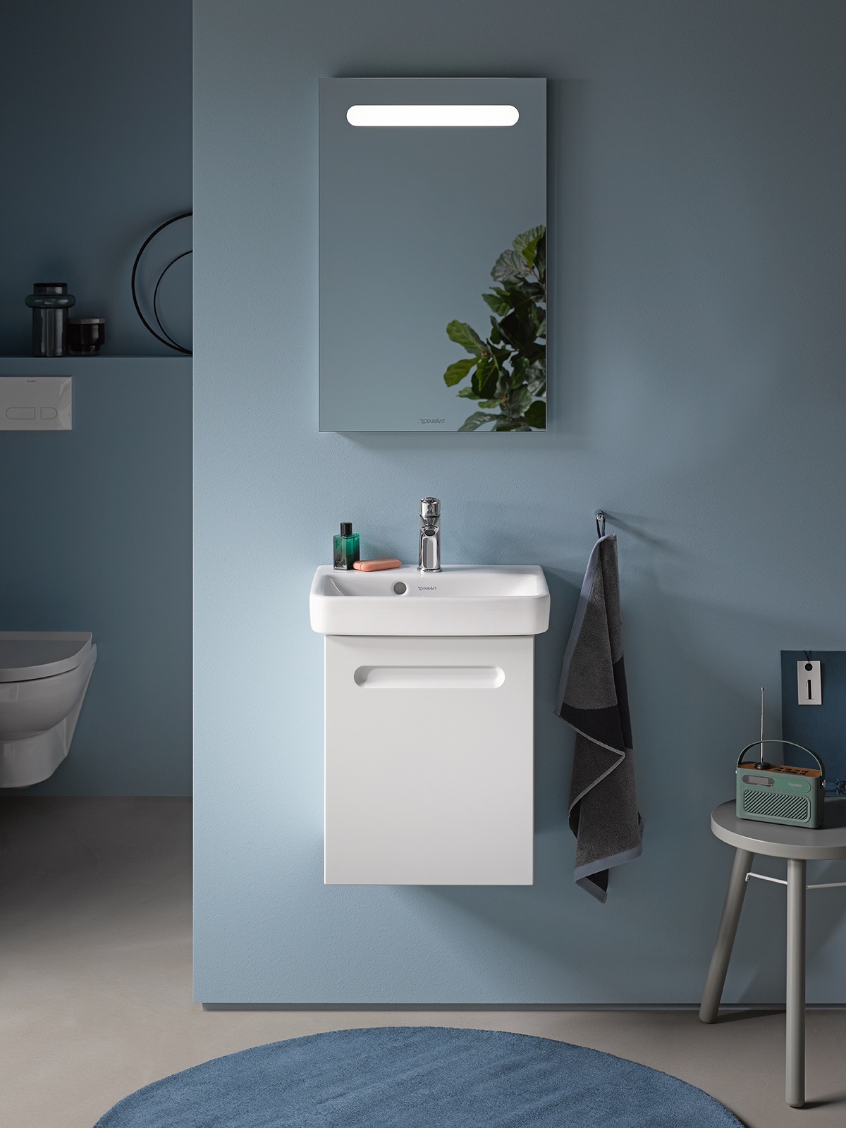 blue bathroom design with white fittings by Duravit