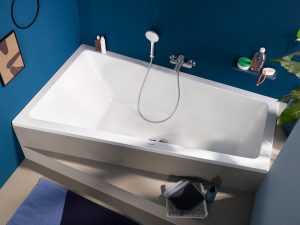 trapezoid shaped bath in a blue bathroom design