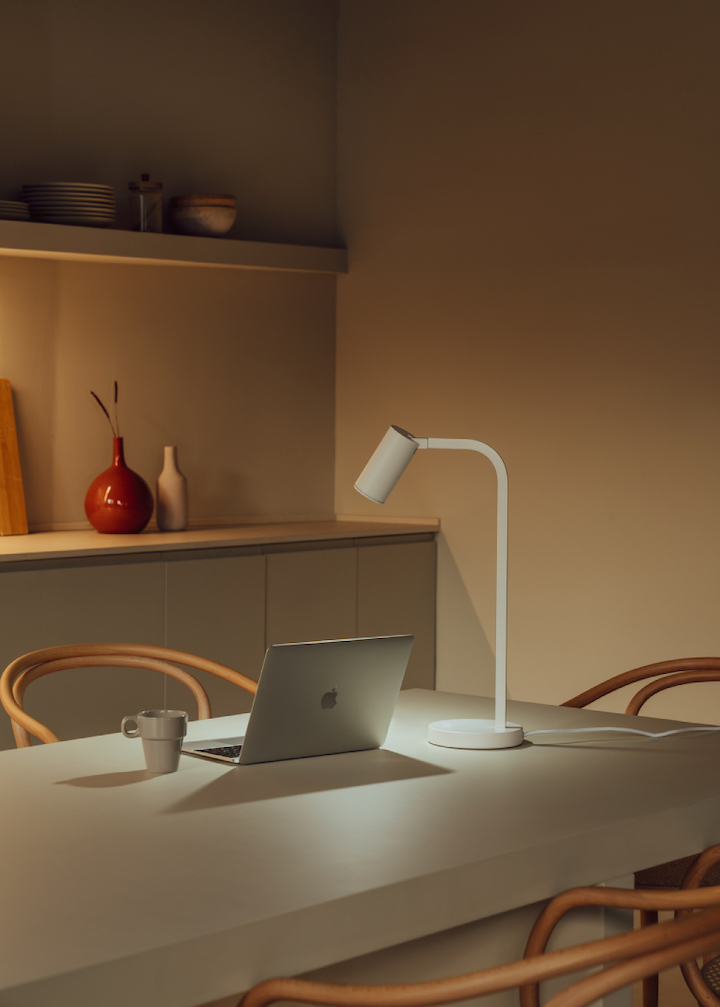 Table light over laptop and workspace