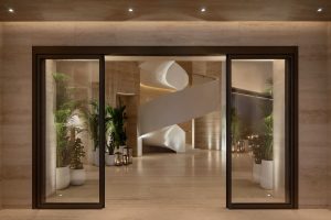 entrance to the Dubai EDITION with organic curved staircase