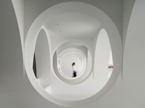 curves, arches and circles define the white interior space